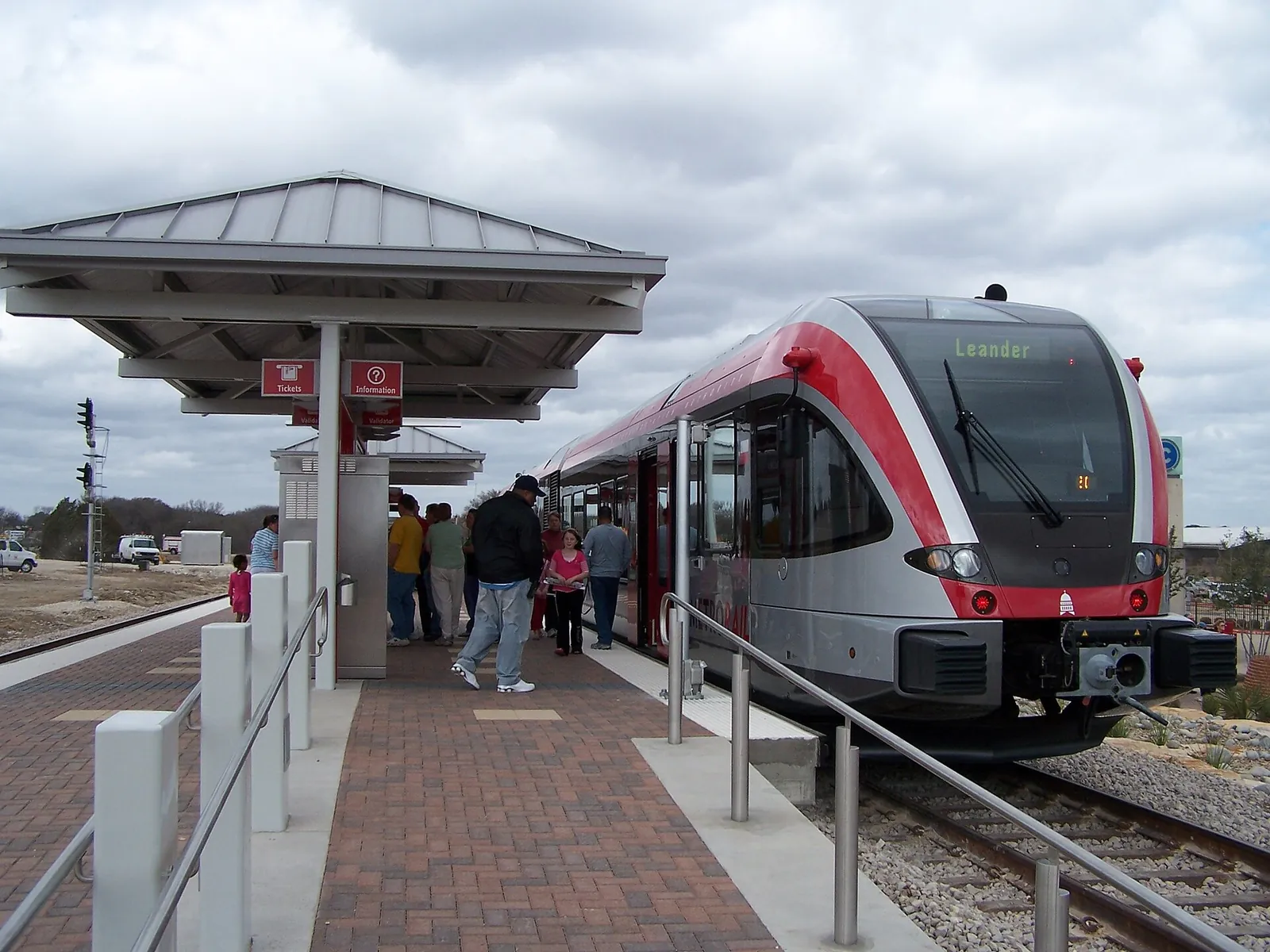 Commuter rail train stopped at the Leander station platform north of Austin